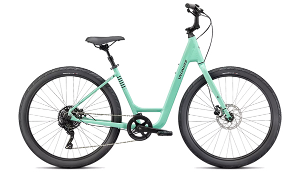 The Specialized/iZip Womens Bike is a light blue step-through with wide tires, disc brakes, and a simple gear system.
