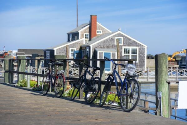 A bunch of bikes lined up by a pier in Nantucket